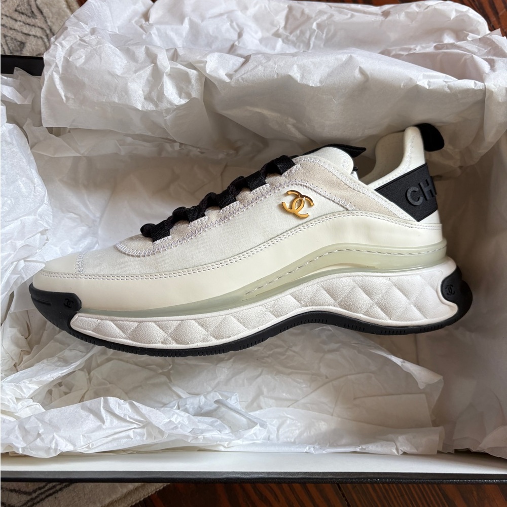 CHANEL Cream and Black Sneakers with Gold Logo